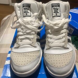 White and blue high top addias